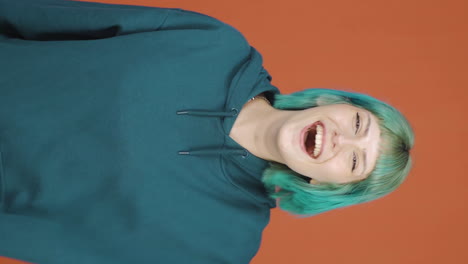 Vertical-video-of-Happy-young-woman-rejoices.